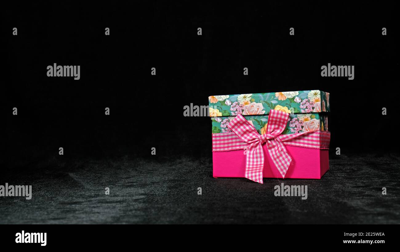 Pink gift on a black background Stock Photo