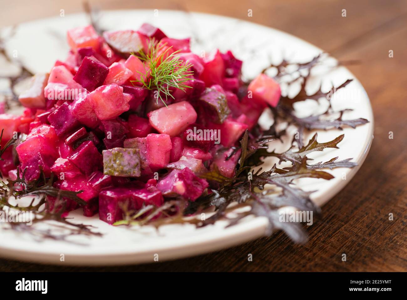 Traditional Finnish beetroot salad with potatoes, apples, carrots and pickles. Stock Photo