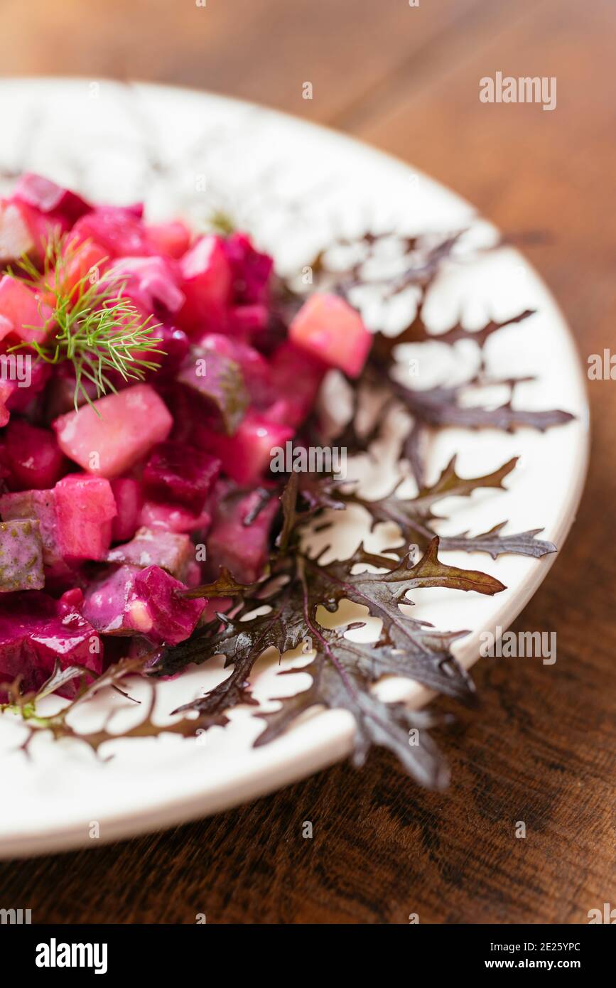 Traditional Finnish beetroot salad with potatoes, apples, carrots and pickles. Stock Photo