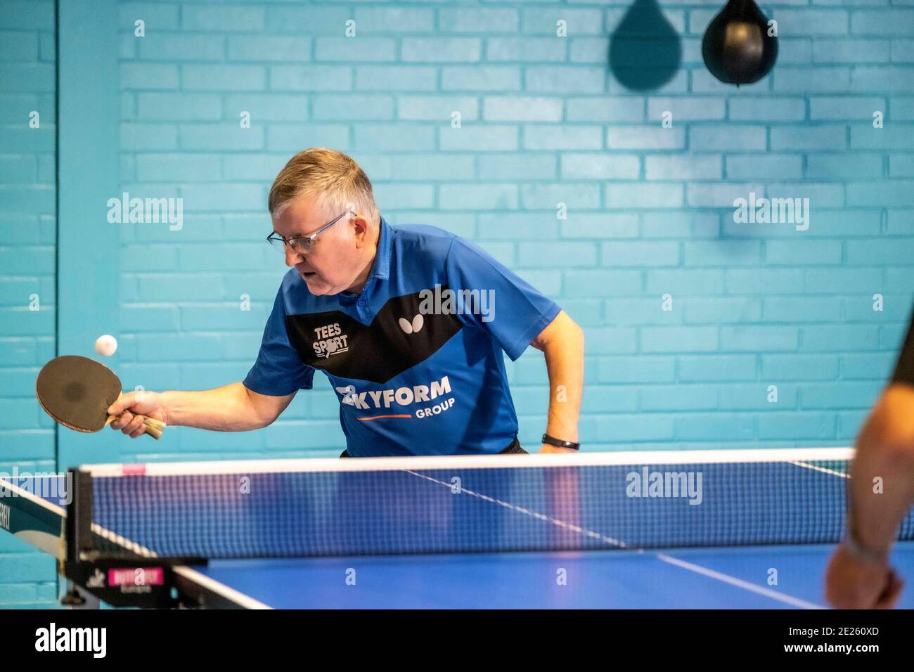 Elderly and disabled people playing table tennis Stock Photo