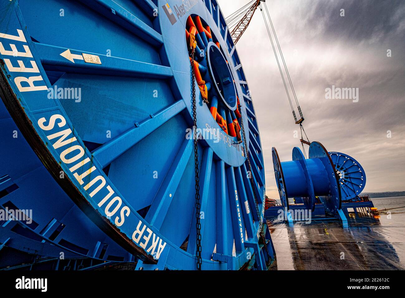 Large North Sea  reels being unloaded at dockside Stock Photo