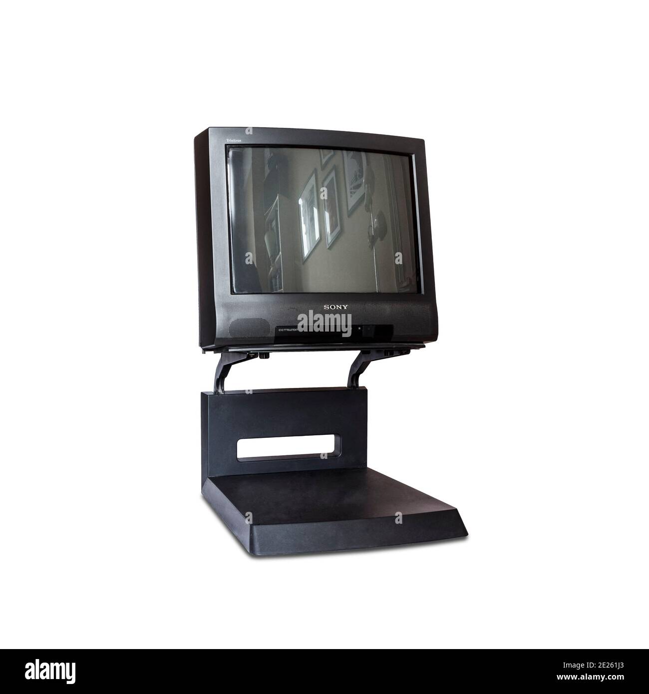 A 1996 black Sony Trinitron CRT television set on its stand, isolated against a white background Stock Photo