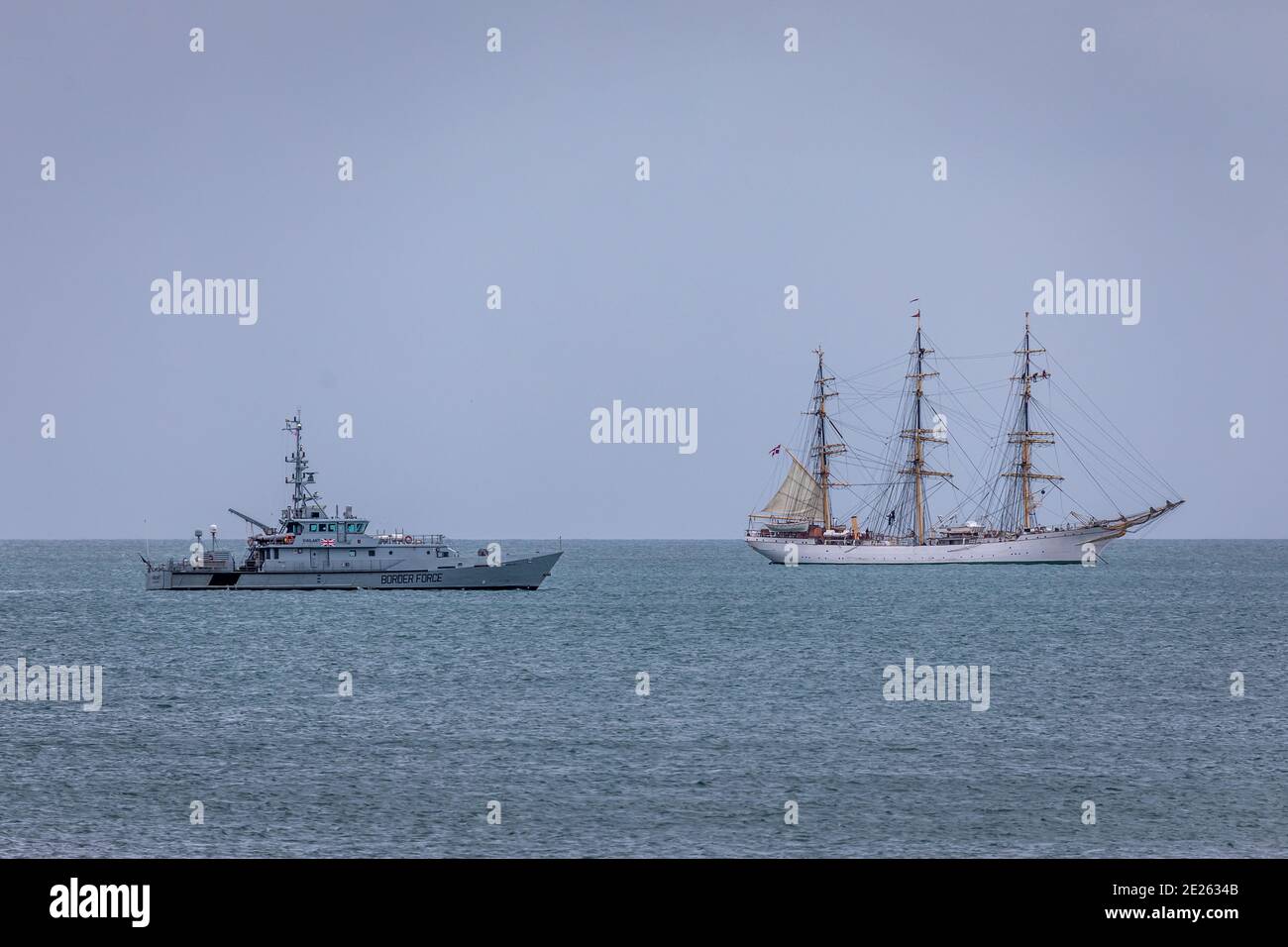 'HMC Vigilant' passes Tall Ship 'Danmark' within Tor Bay, Paignton Stock Photo