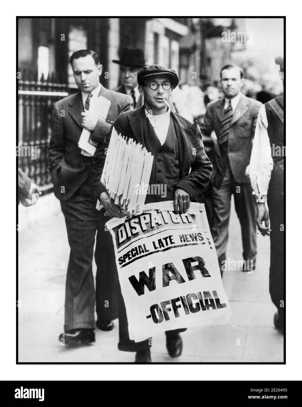 NEWS HEADLINE WAR 1939  WW2 UK news vendor for The London Dispatch newspaper holding poster announcing 'WAR OFFICIAL' the start of Second World War in Great Britain World War II Stock Photo