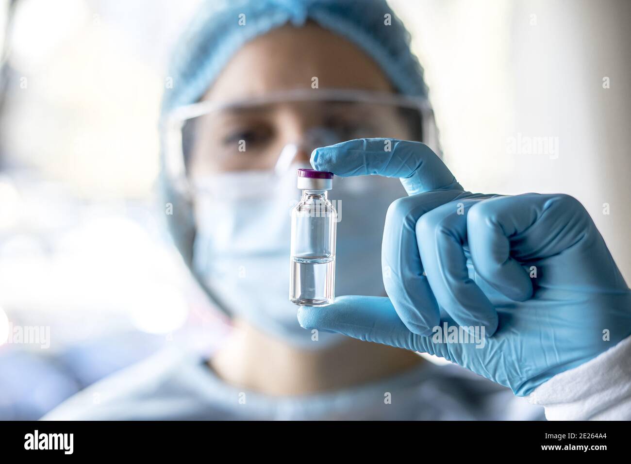 Doctor or laborant holding tube with nCoV Coronavirus vaccine for 2019-nCoV virus Stock Photo