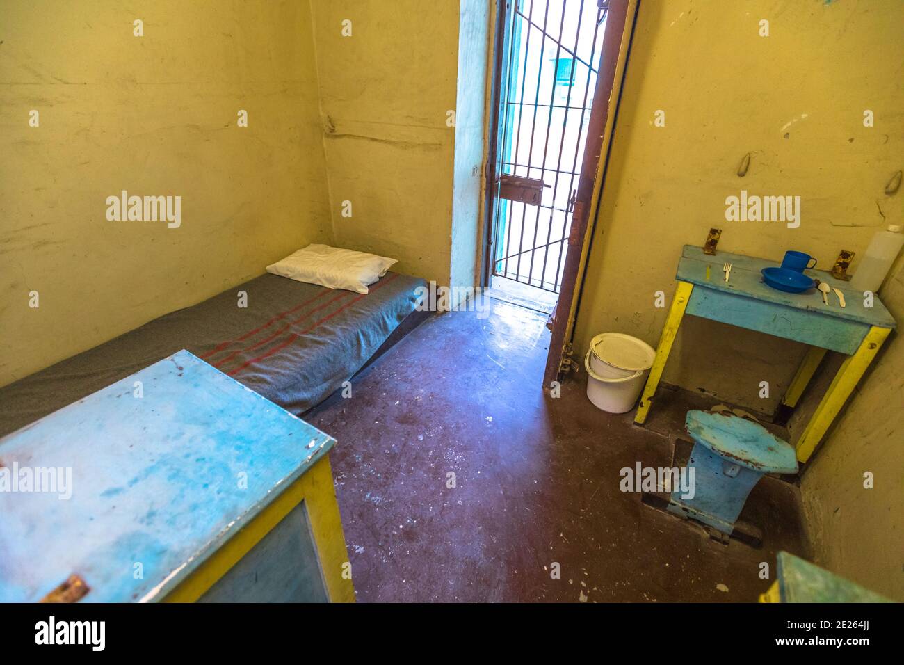 Fremantle, Western Australia - Jan 5, 2018: single cell with bed and toilet of Fremantle Prison an old convicts jail built in 1855. memorial museum Stock Photo