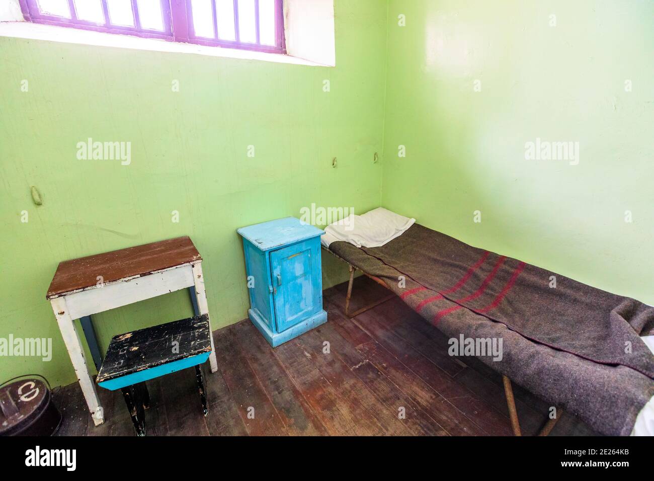 Fremantle, Western Australia - Jan 5, 2018: single cell with bed and bedside table of Fremantle Prison an old convicts jail built in 1855. Memorial Stock Photo