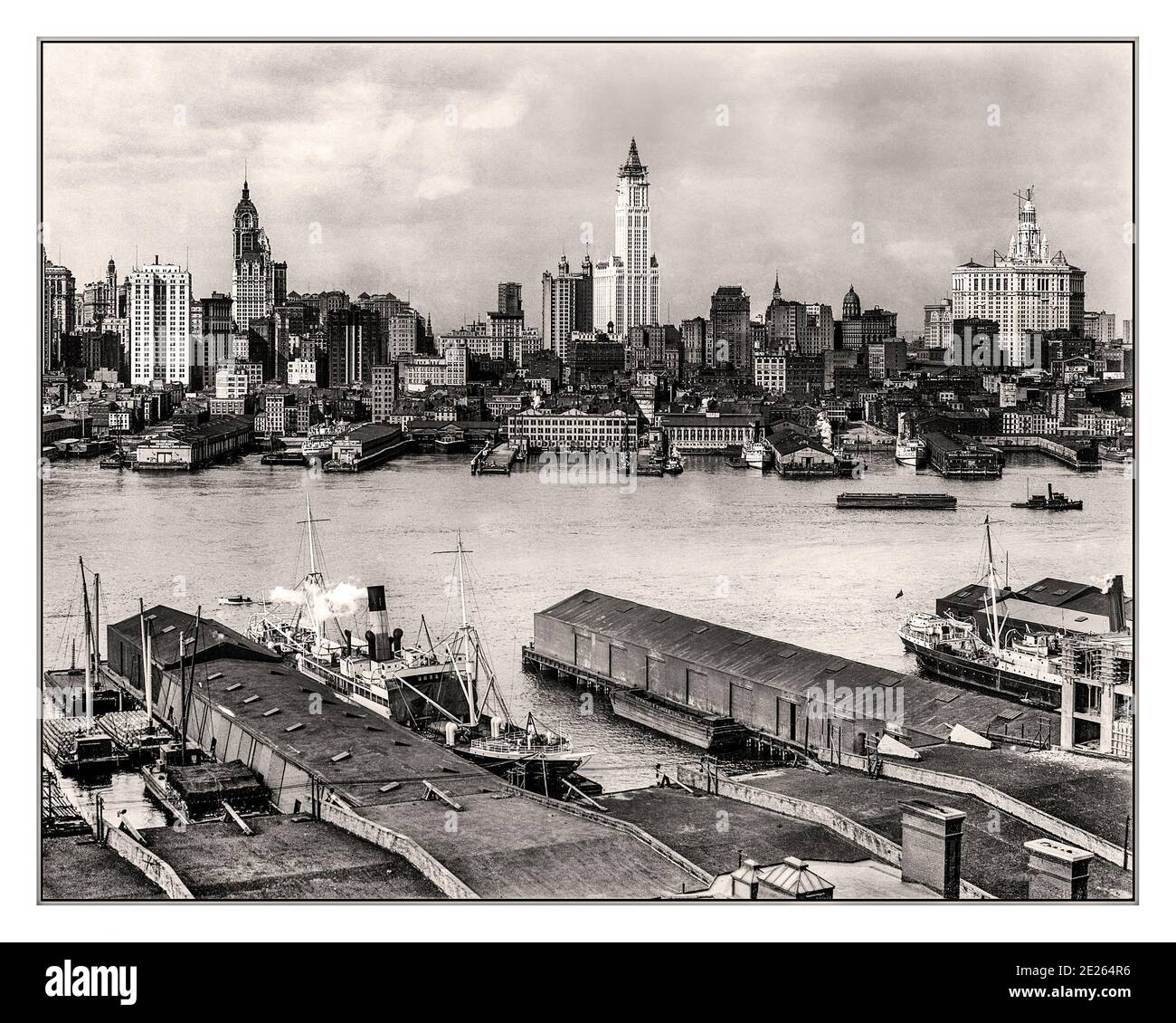 1900's Archive Manhattan historic skyline New York circa 1912. Manhattan skyline from Brooklyn. The Singer Building rises at left along with the Woolworth tower and Municipal Building, both still under construction. Manhattan New York USA Stock Photo