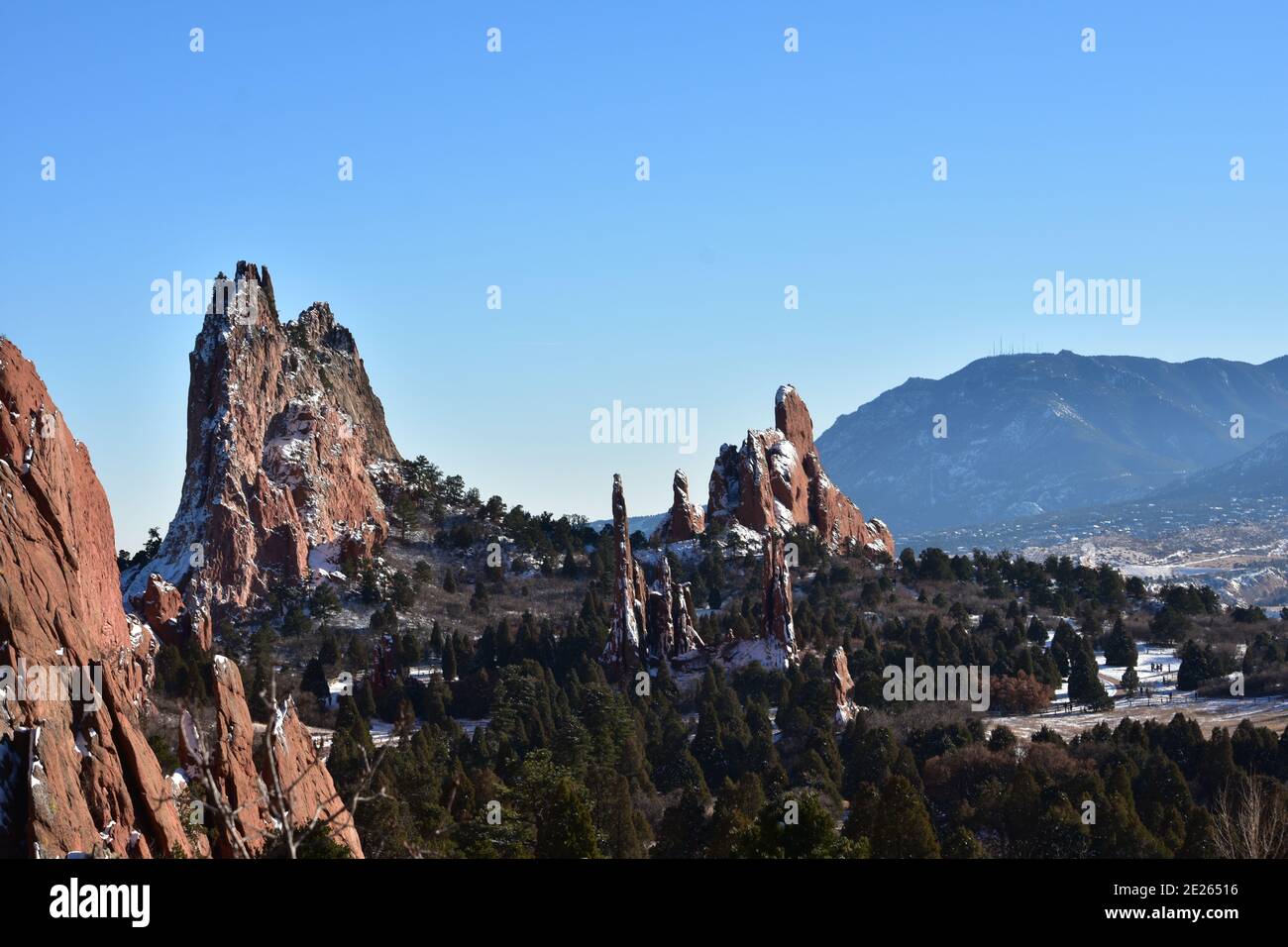 Blue skies over Garden of the Gods with Norad and Cheyenne Mountain in the background after a winter storm Stock Photo