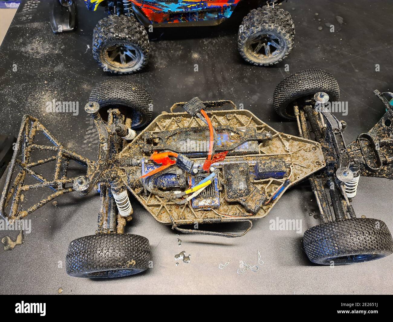 Close up view of dirty disassembled radio controlled toy car. Stock Photo