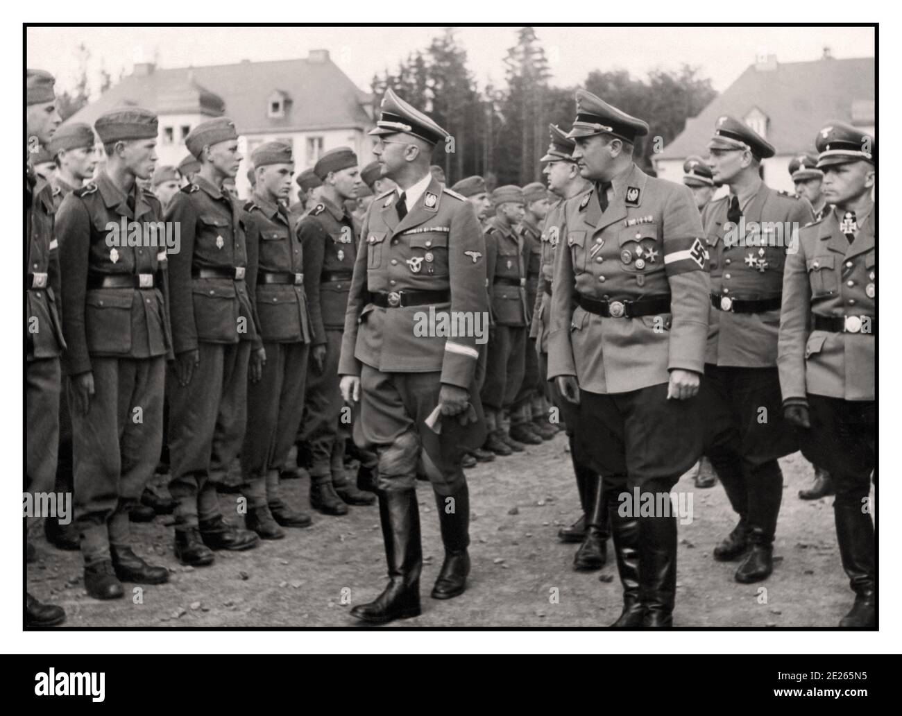 HIMMLER WW2 Propaganda photo of  Reichsfuhrer of the Schutzstaffel Heinrich Himmler and Artur Axmann head of the Hitler Youth (Hitlerjugend) inspecting training recruits in 1943 World War II Second World War Nazi Germany Stock Photo