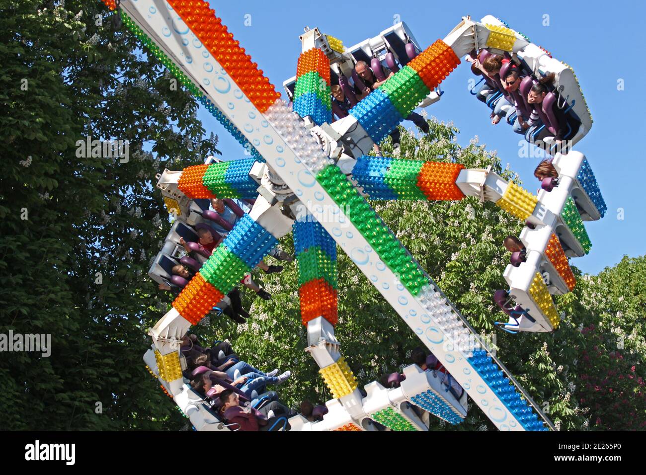 Amusement park rides with blue sky as background Stock Photo - Alamy