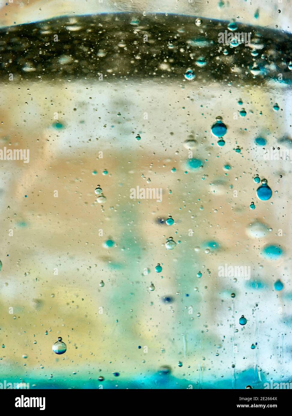 Abstract of colourful bubbles rising through liquid, background ...