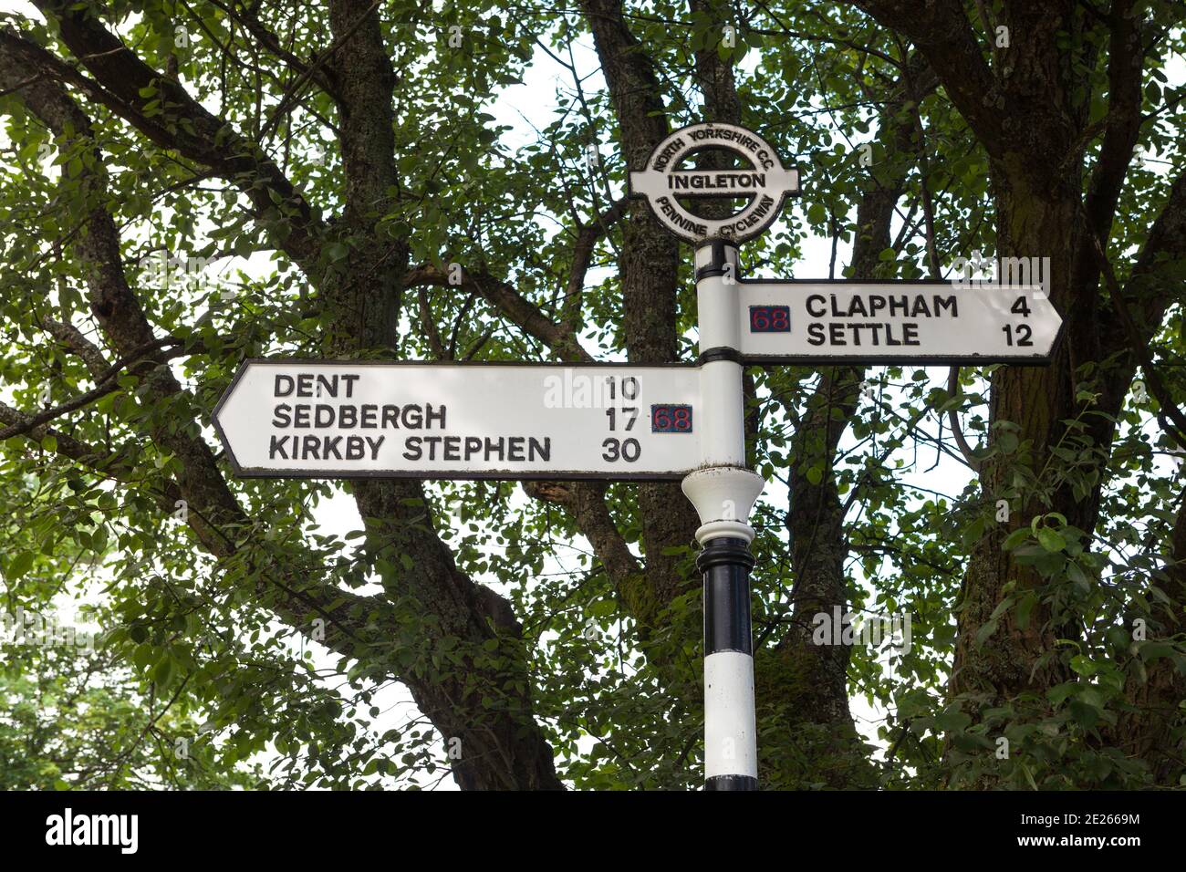 Pennine Cycleway direction and distance signpost in Ingleton, North Yorkshire Stock Photo