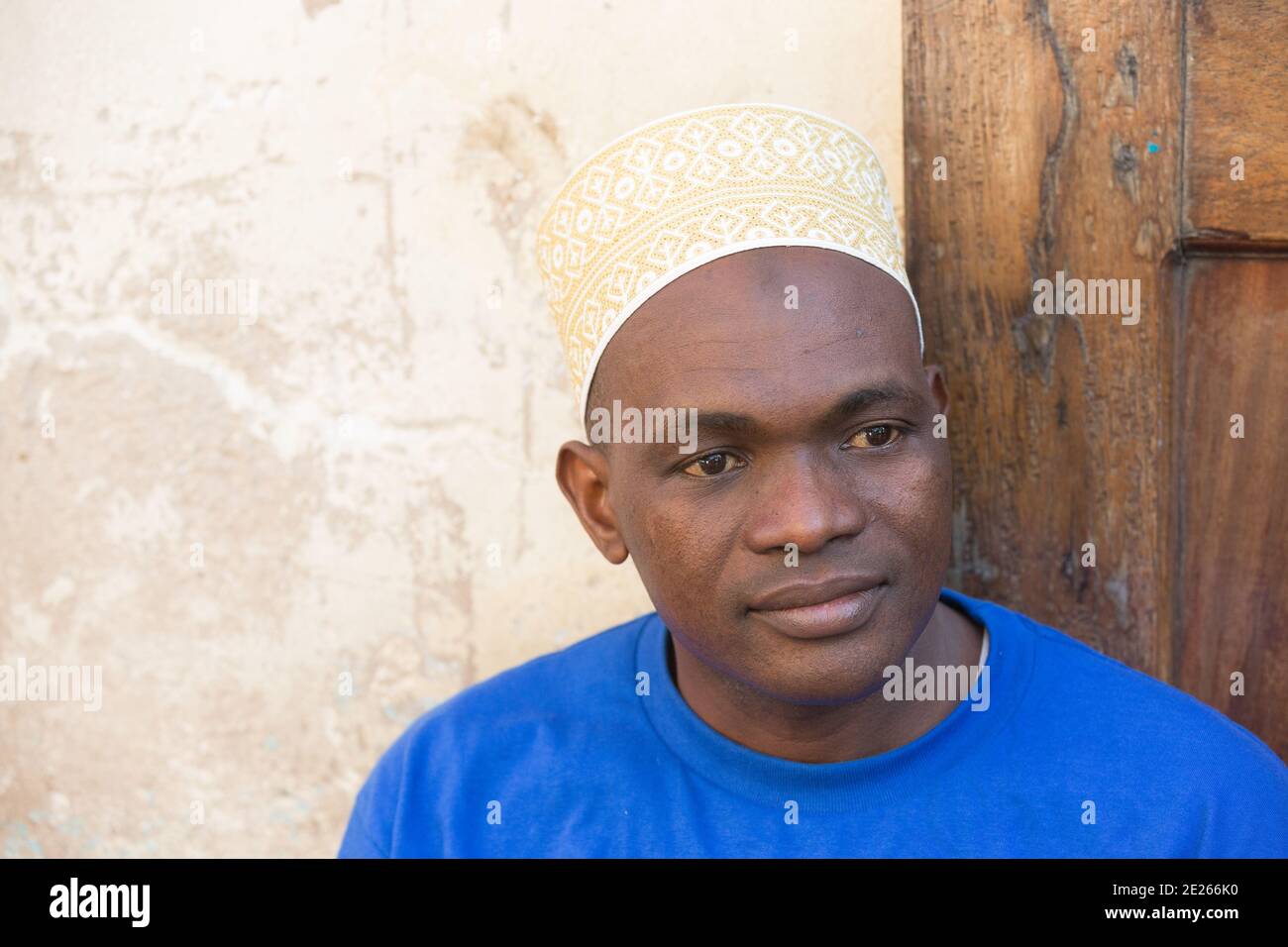 Stone Town, Zanzibar, Tanzania : Portrait of Man Wearing Kofia hat. Stock Photo