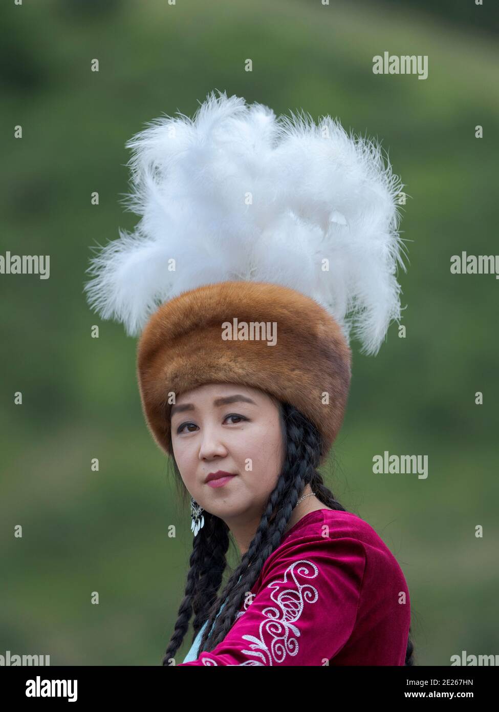 Musican in traditional garb. Folk Festival commemorating the origin myth the Tien Shan Maral (Tian Shan wapiti), an origin myth of the Kyrgyz tribes. Stock Photo