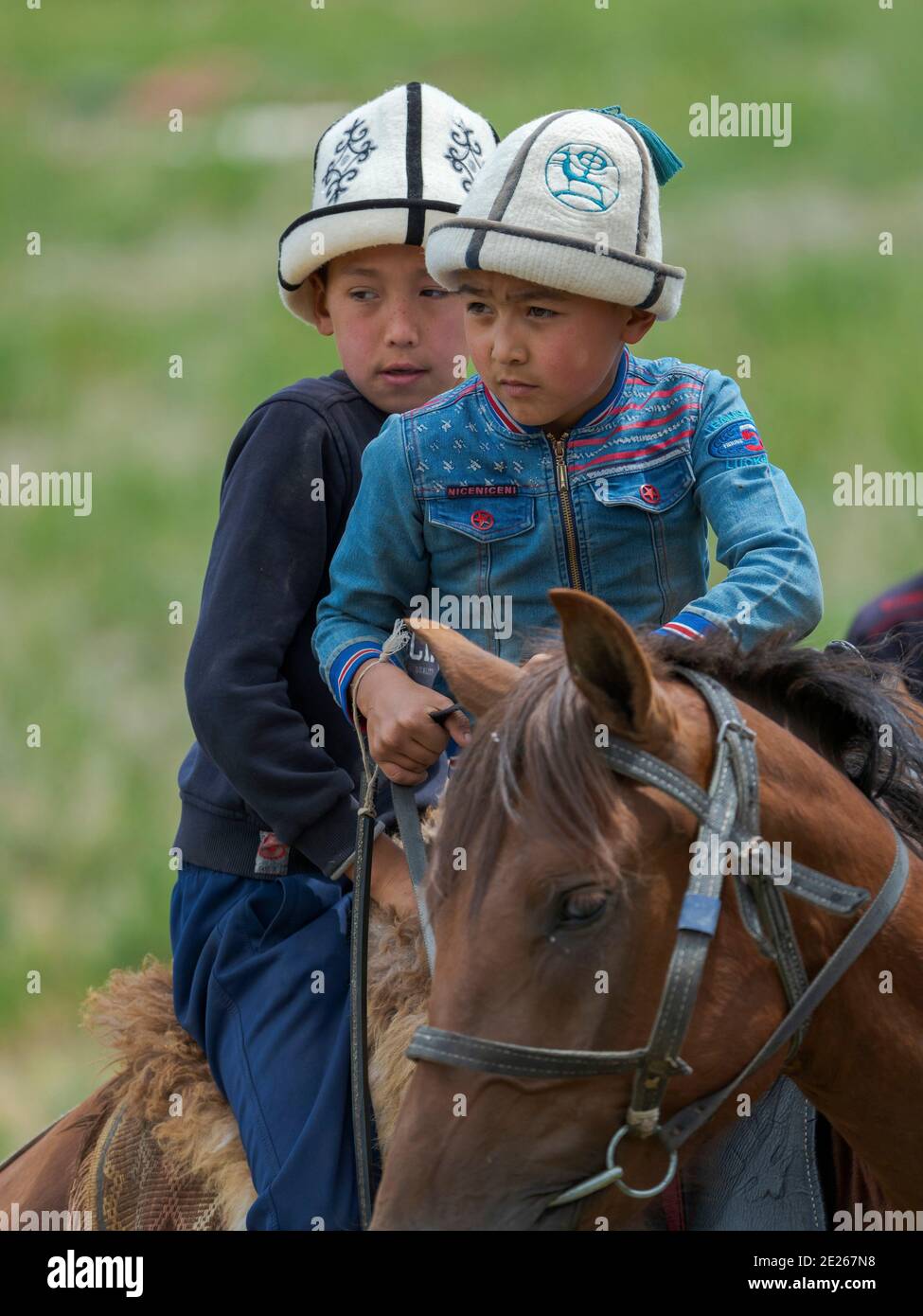 Child on horseback.  Folk Festival commemorating the origin myth the Tien Shan Maral (Tian Shan wapiti), an origin myth of the Kyrgyz tribes. Near Tas Stock Photo