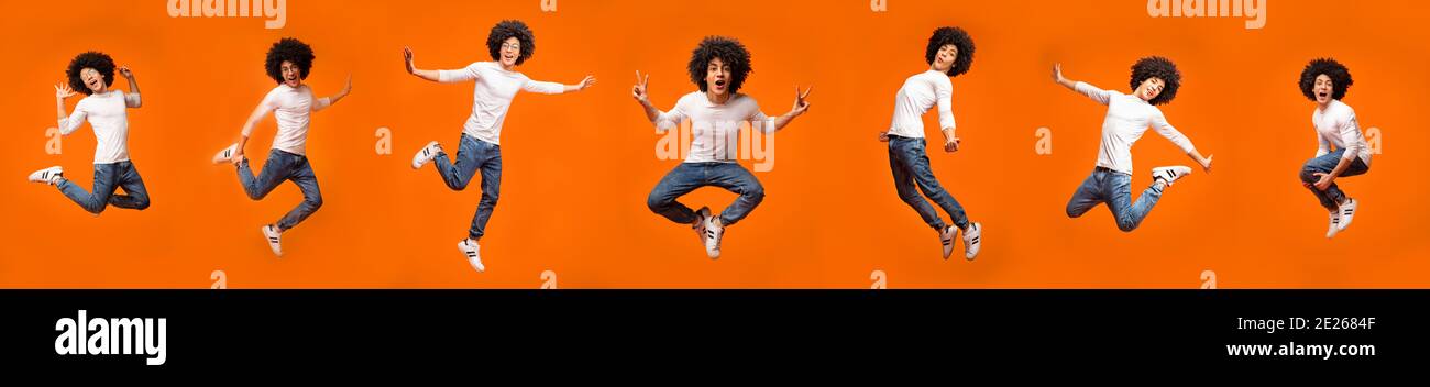 Guy Jumping And Having Fun Posing In Mid-Air, Orange Background Stock Photo