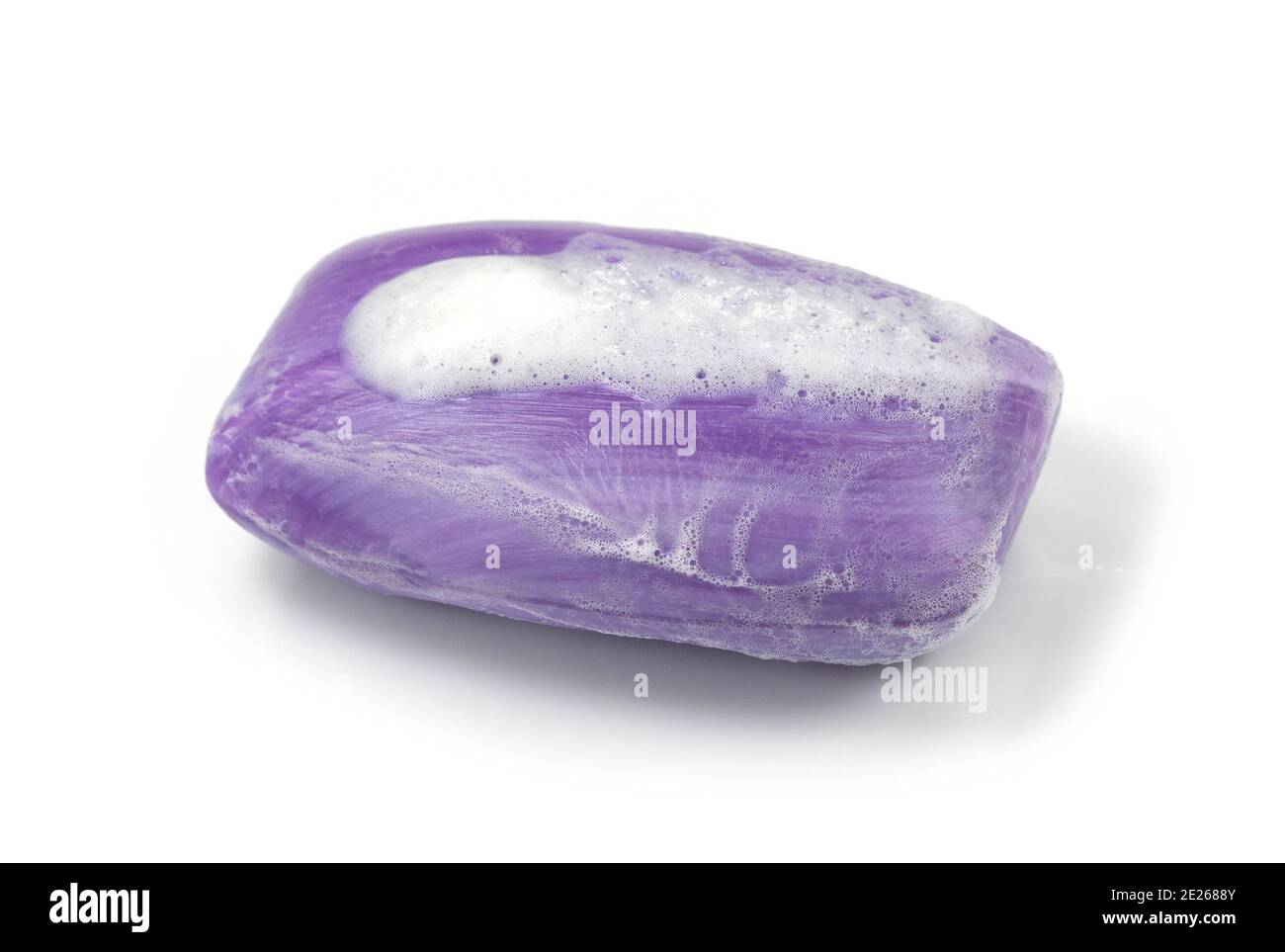 Soap bar with foam isolated on white background. Wet bar of soap Stock