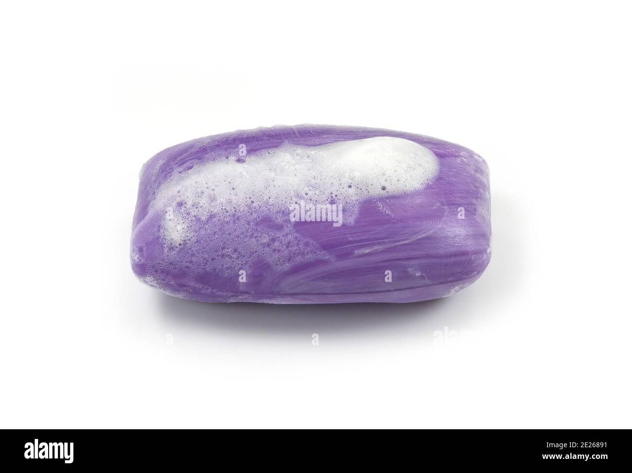 Soap bar with foam isolated on white background. Wet bar of soap Stock