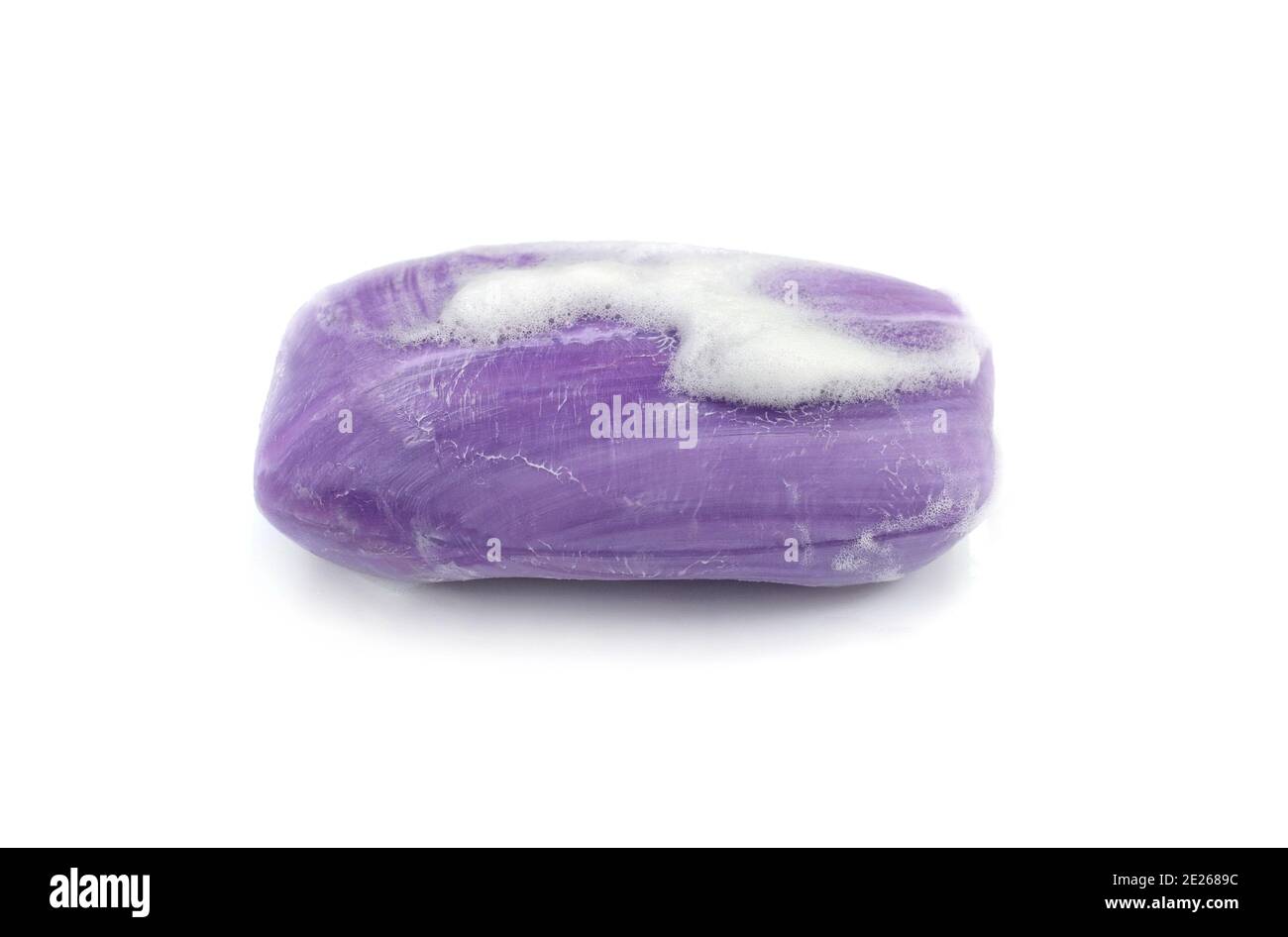 Soap bar with foam isolated on white background. Wet bar of soap Stock