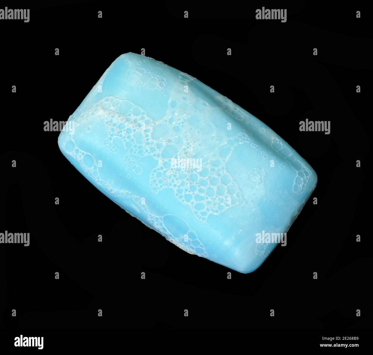 Soap bar with foam isolated on white background. Wet bar of soap Stock