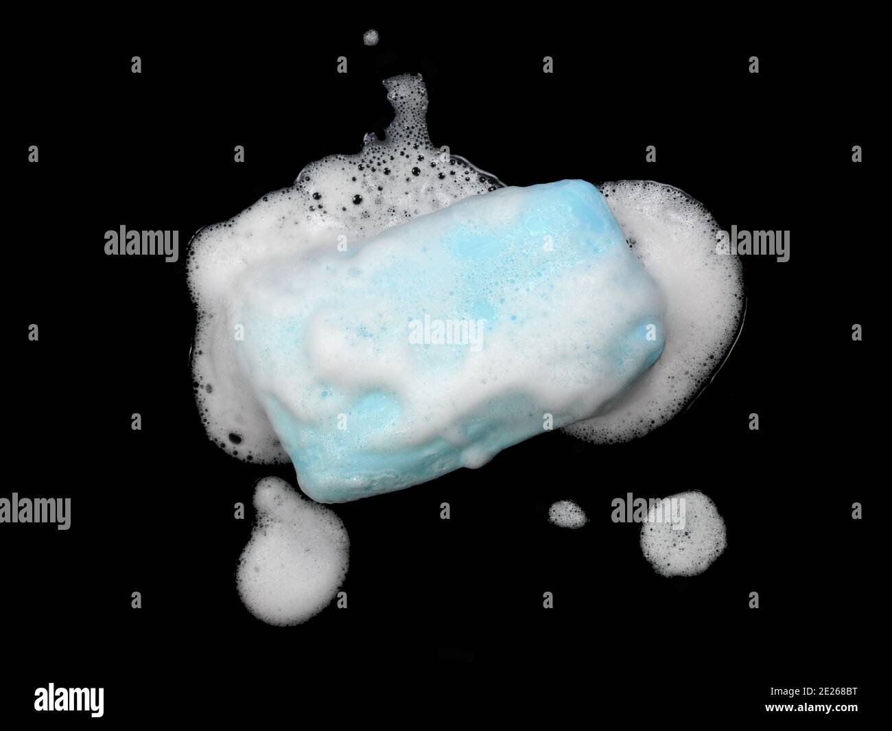 Soap bar with foam isolated on white background. Wet bar of soap Stock