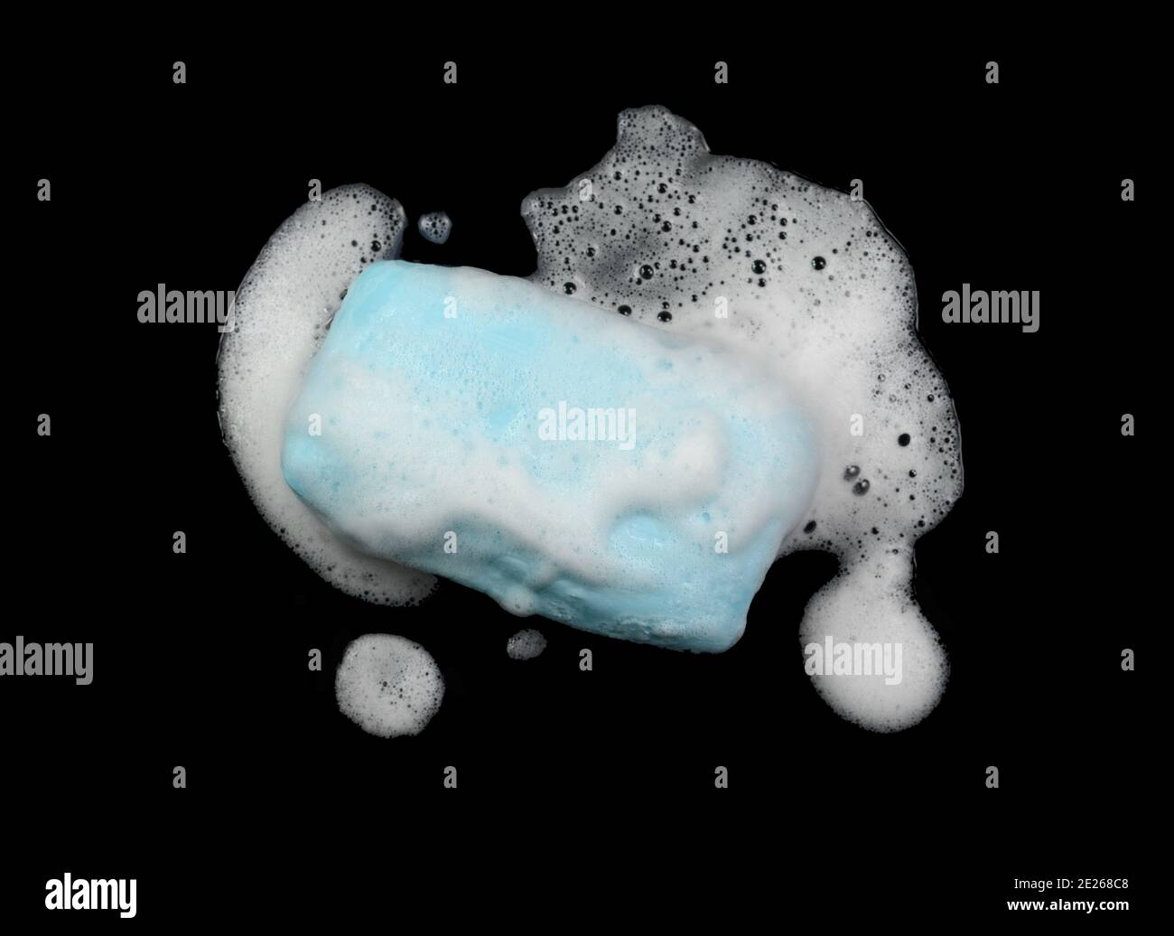 Soap bar with foam isolated on white background. Wet bar of soap Stock