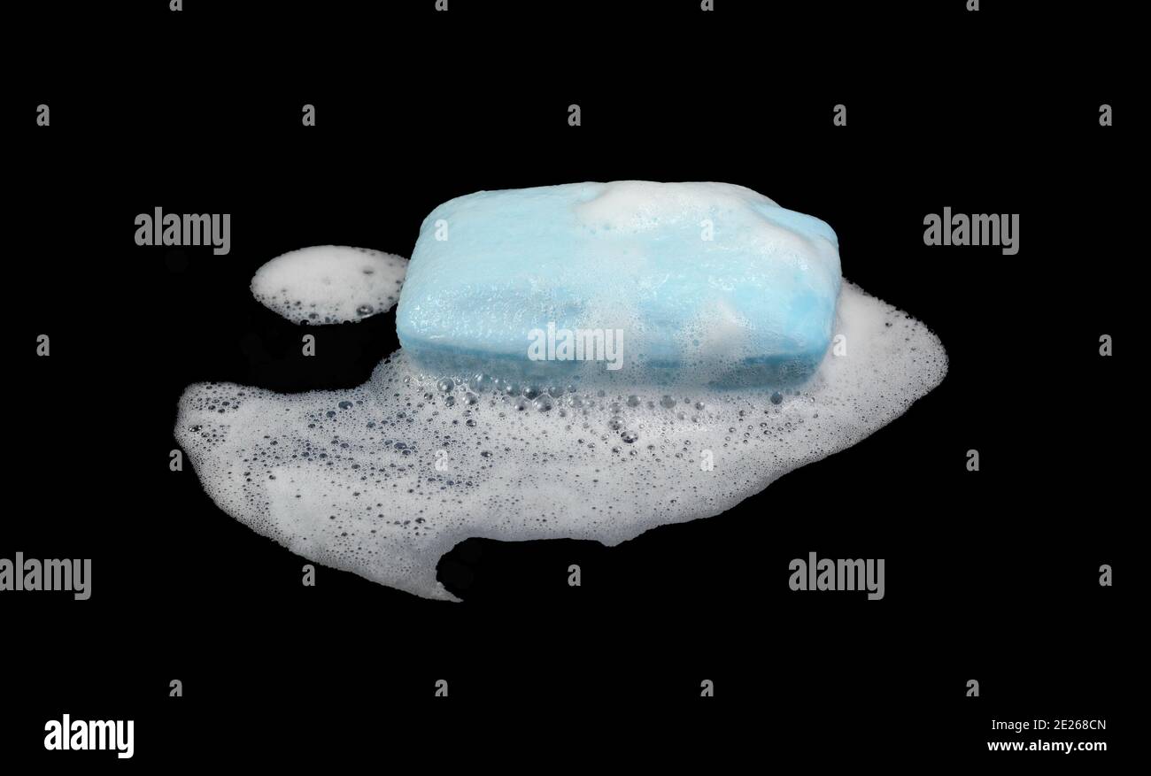 Soap bar with foam isolated on white background. Wet bar of soap Stock