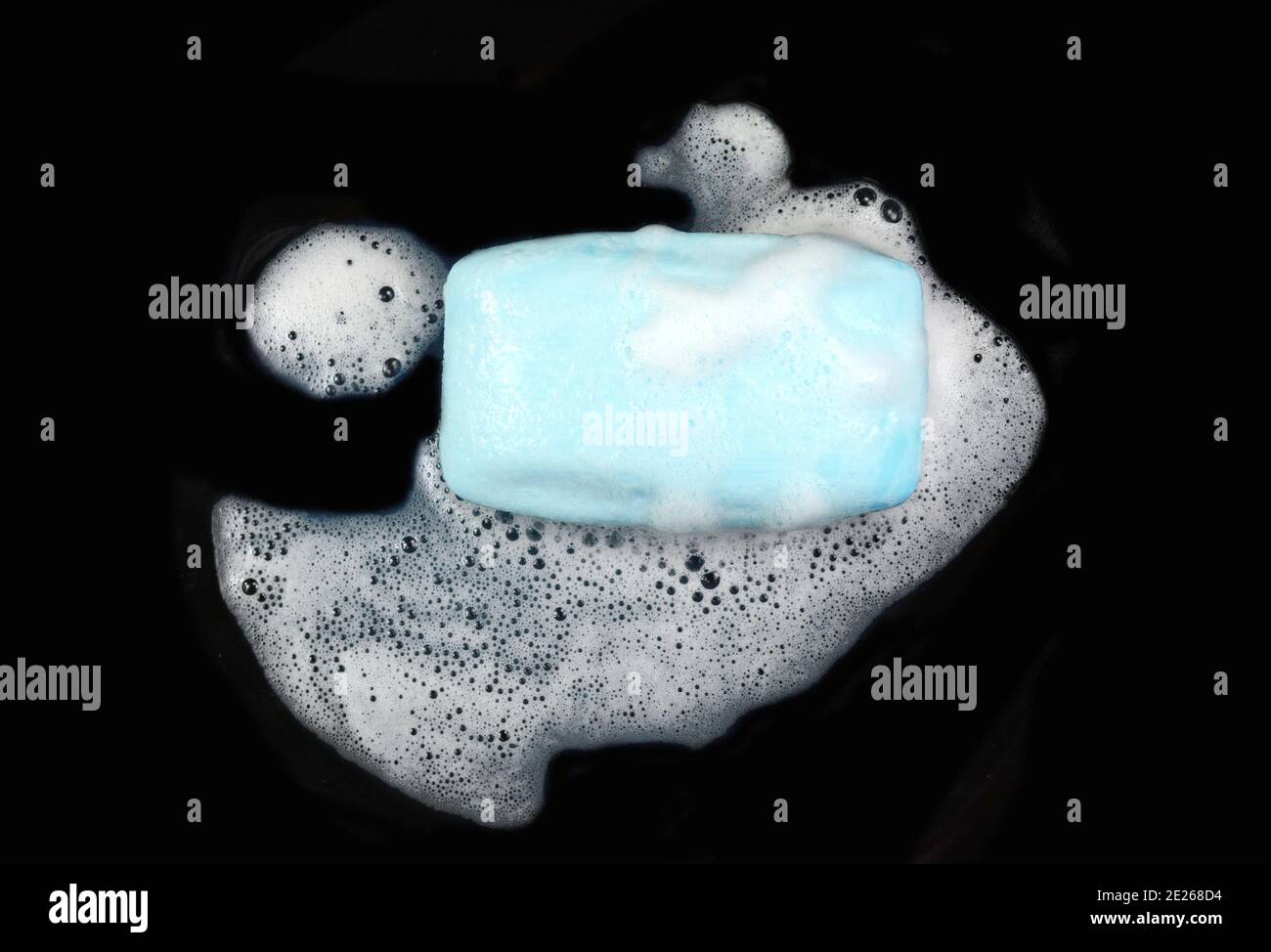 Soap bar with foam isolated on white background. Wet bar of soap Stock