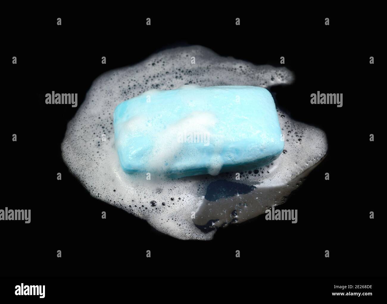 Soap bar with foam isolated on white background. Wet bar of soap Stock