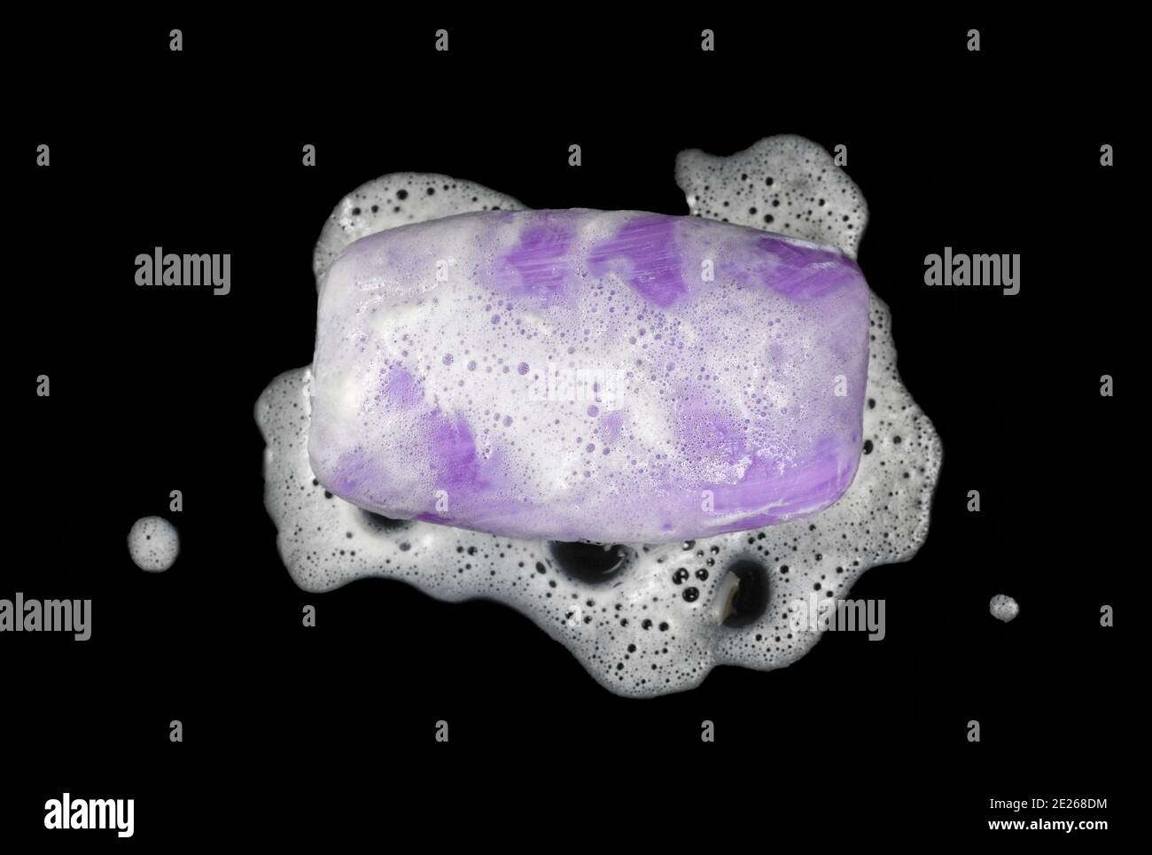 Soap bar with foam isolated on white background. Wet bar of soap Stock