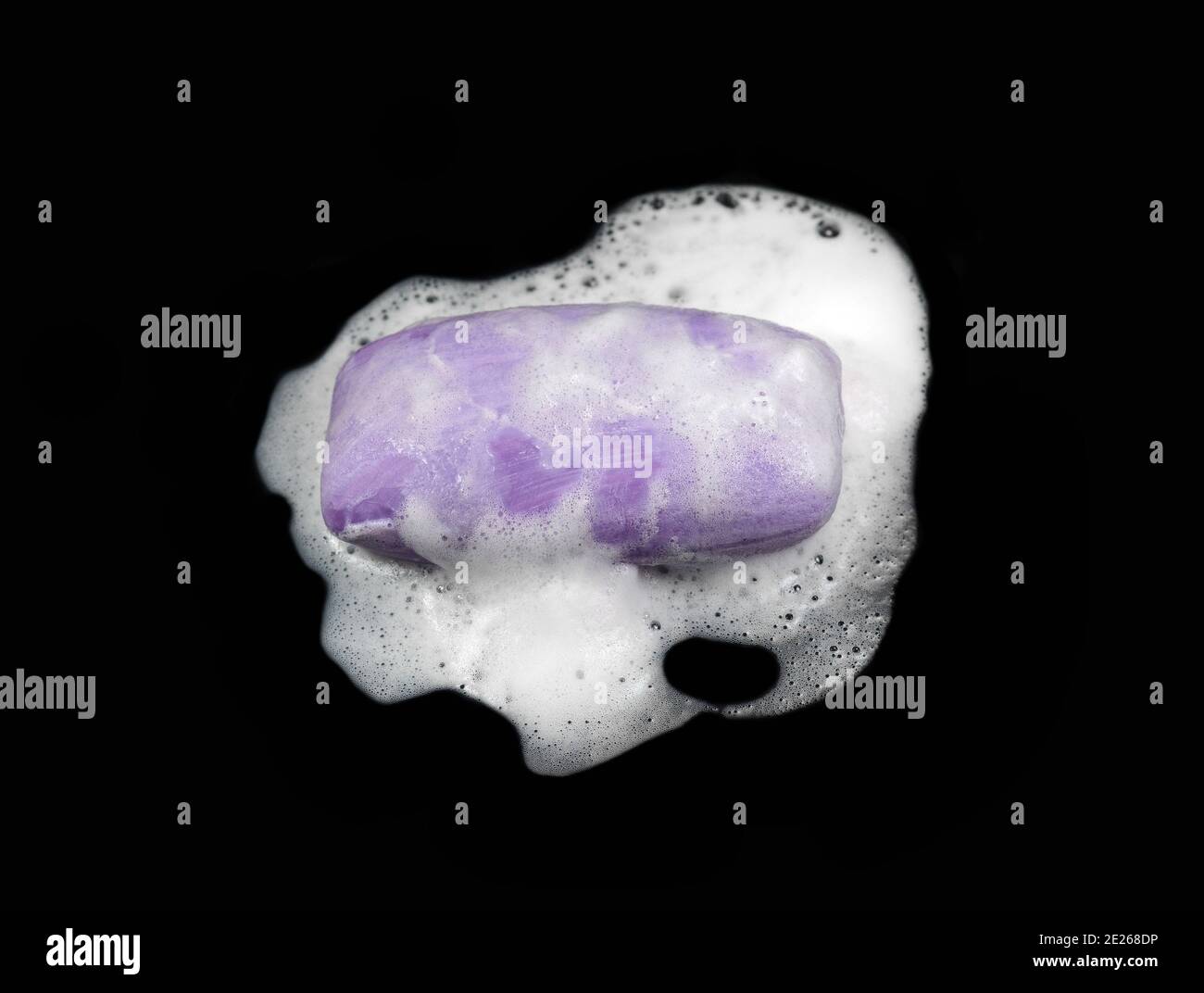 Soap bar with foam isolated on white background. Wet bar of soap Stock