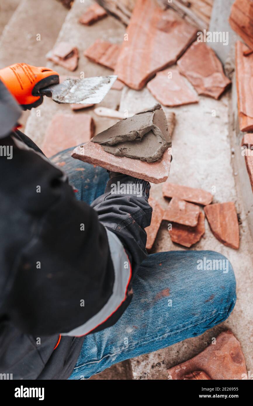 Bonding granite tiles to concrete subfloors outside the house porch