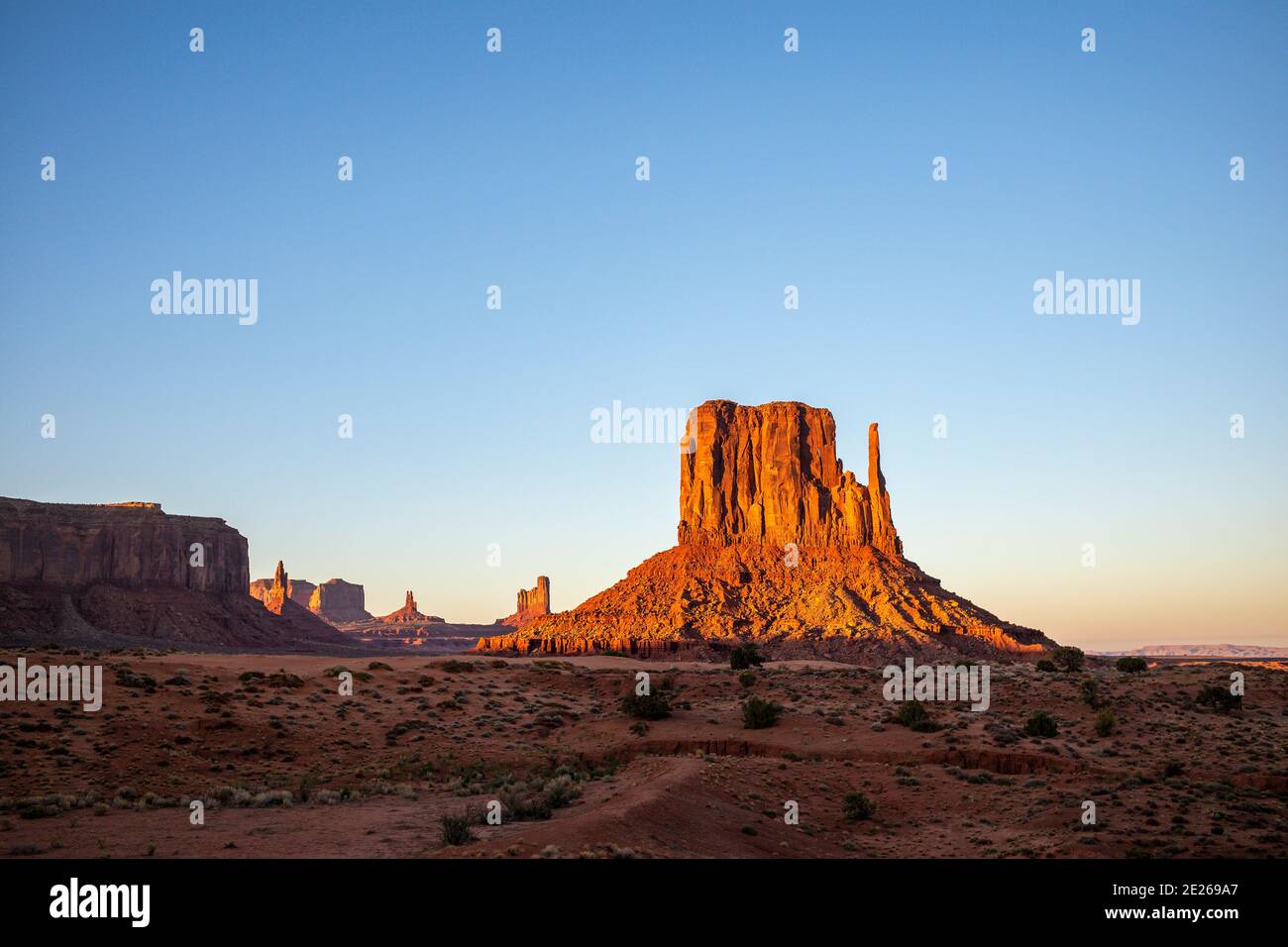 Sunset on the iconic West Mitten rock formation in Monument Valley ...