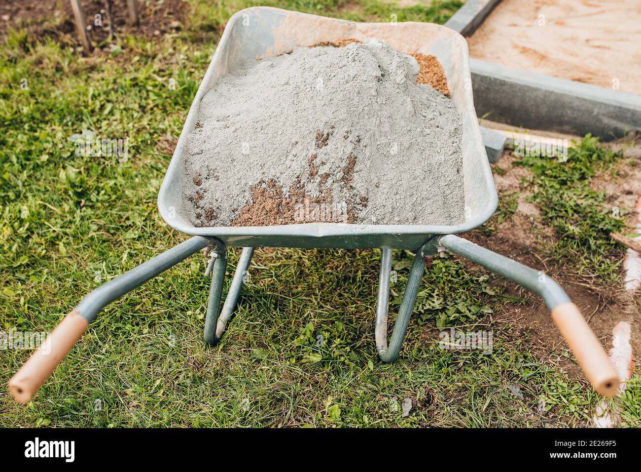 A dry mixture of sand and cement for strengthening the base for laying paving slabs the