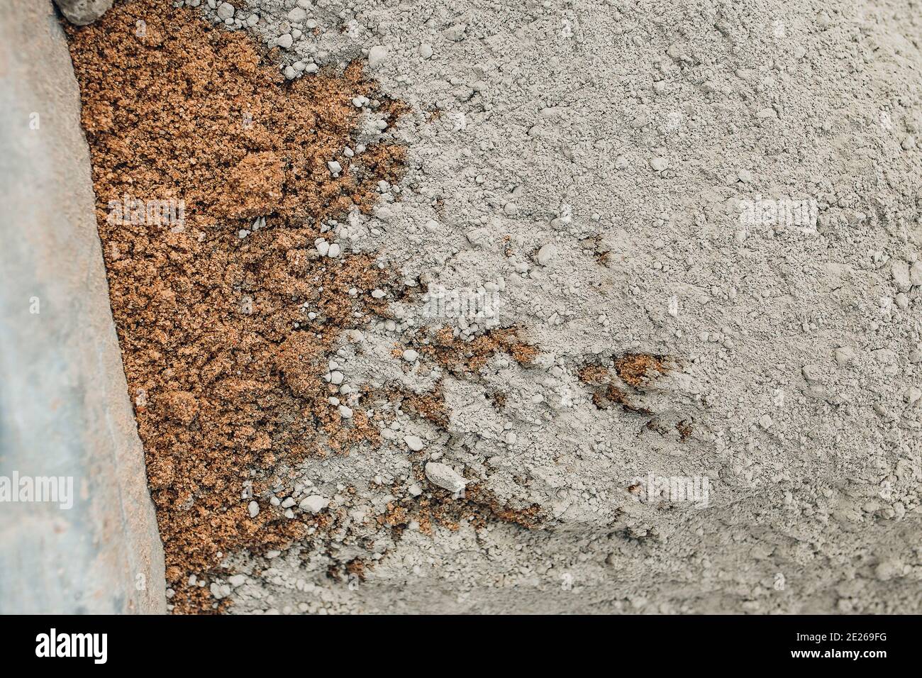 A dry mixture of sand and cement for strengthening the base for laying