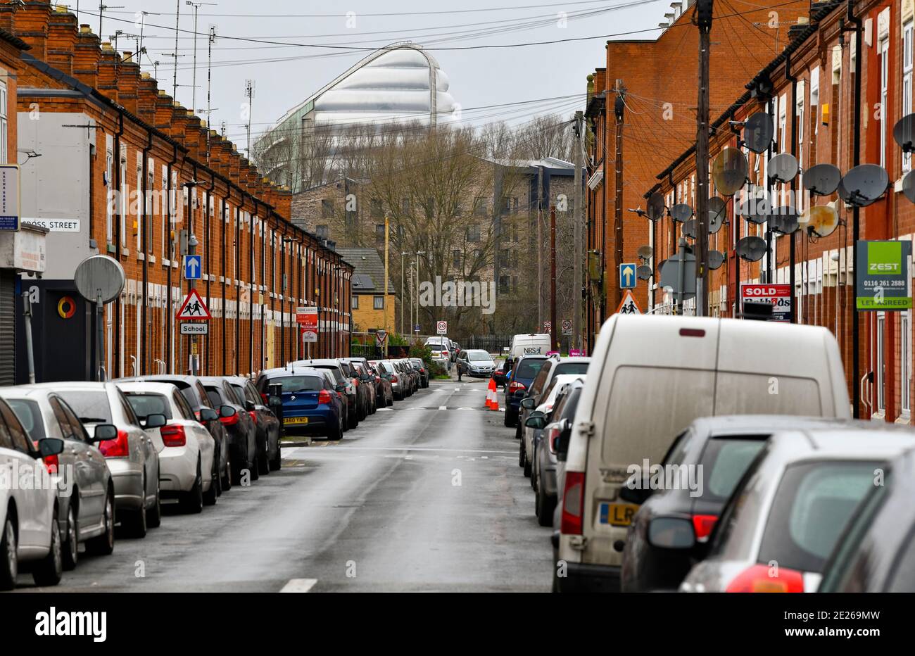 Terraced houses in Belgrave, Leicester. Space centre in the background