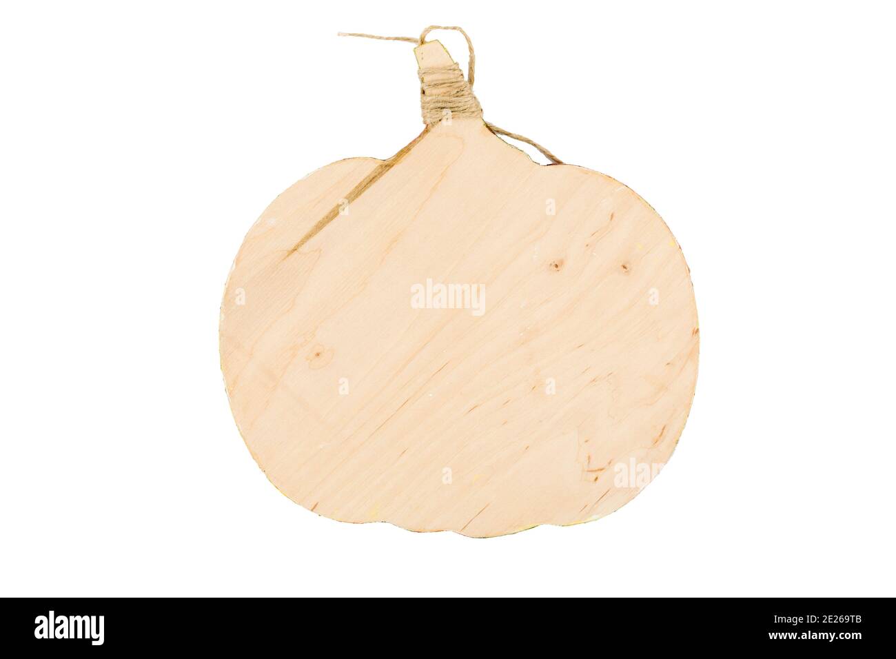 Wooden cutting board in the shape of a vegetable. It is isolated in a white background. Close-up. Stock Photo