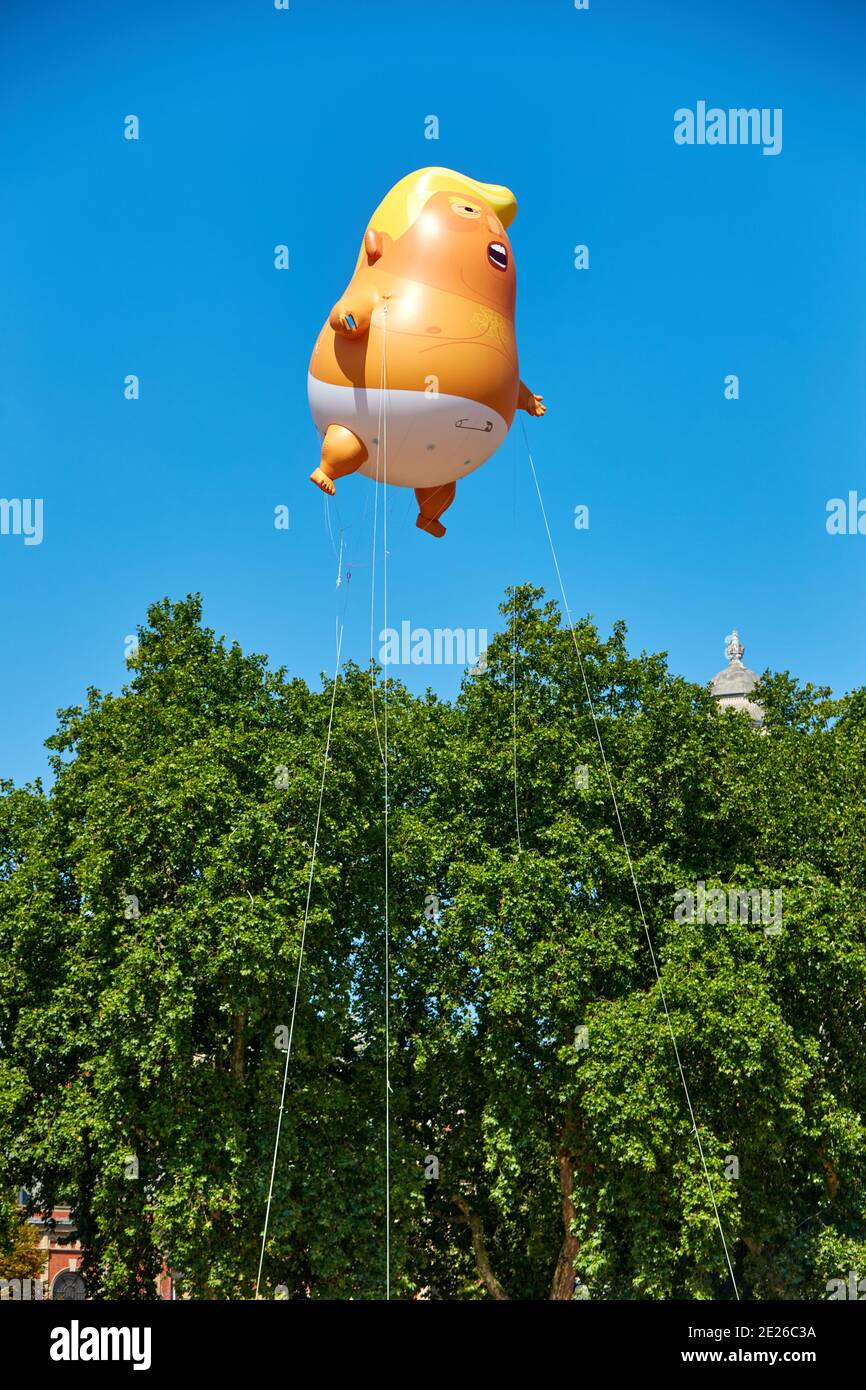 Trump Baby blimp flying in Parliament Square during an official visit by the US President to London Stock Photo