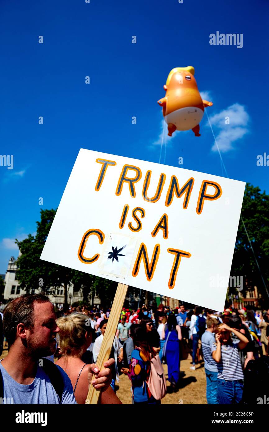 Man holding a sign reading Trump is a C*nt in Parliament Square during an official visit by the US President to London Stock Photo