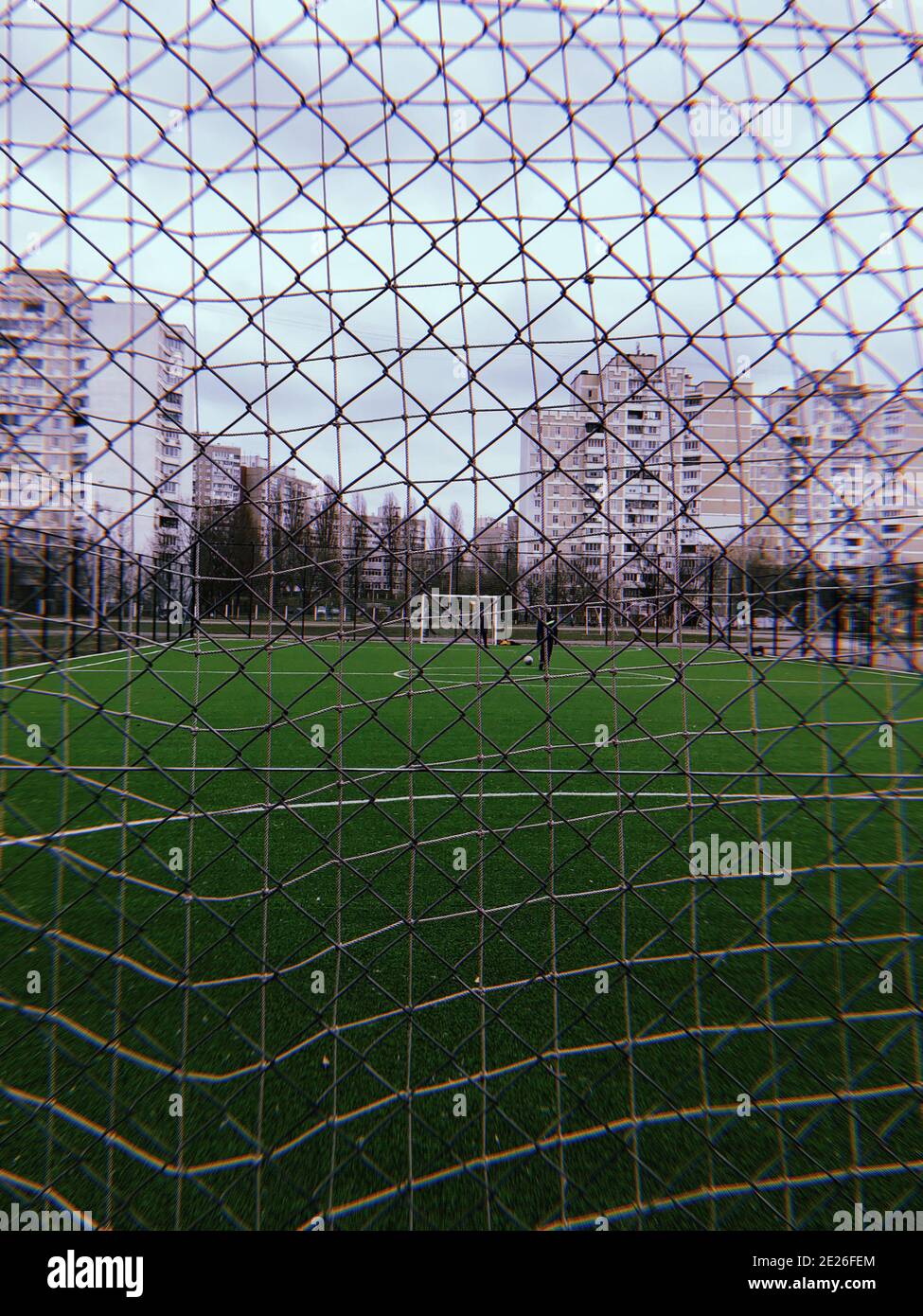 Metal safety net closeup of a soccer field, outdoor sports game Stock