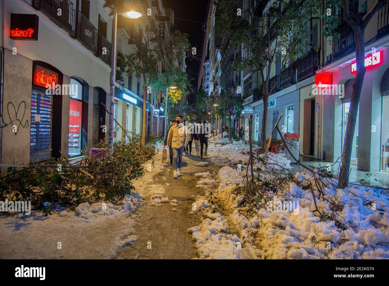 Madrid, Spain. 11th Jan, 2021. (1/11/2021) More than 150,000 trees could be affected by the storm Filomena. Also hundreds of wrecked vehicles on the streets of Madrid. The snow is still accumulated on the street furniture and on the roofs and you have to be very careful when walking on the street.After the heavy snowfall, the damage was seen: Streets and avenues with thousands of trunked trees and broken branches on the ground. In Fuencarral street the scene was as if a cataclysm had occurred (Photo by Alberto Sibaja/Pacific Press/Sipa USA) Credit: Sipa USA/Alamy Live News Stock Photo