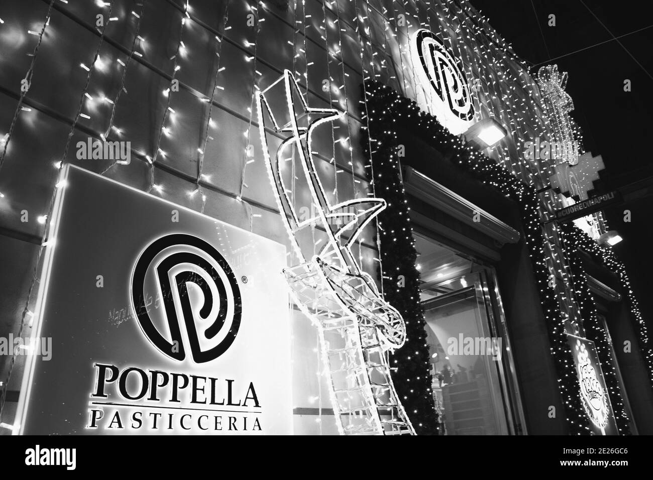 Naples, Italy. Famous Poppella pastry shop known for its tasty traditional sfogliatella, fiocco di neve, baba, cannoli. Black white historic photo Stock Photo