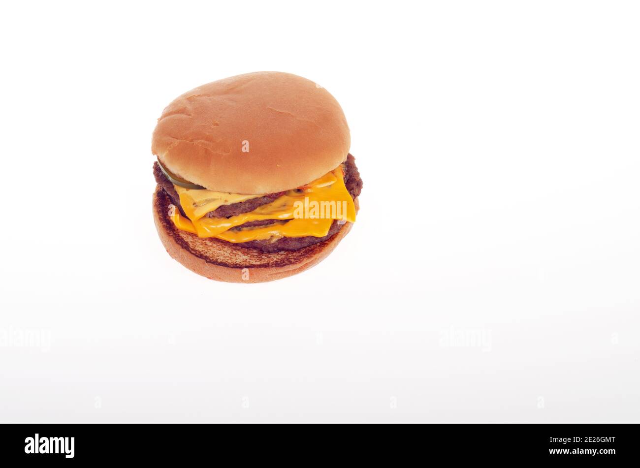 McDonalds Triple Cheeseburger on white background Stock Photo