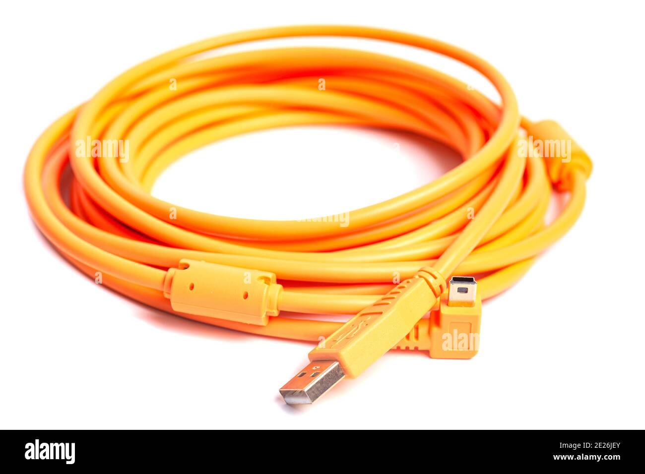Orange rolled cable isolated on white background. Stock Photo