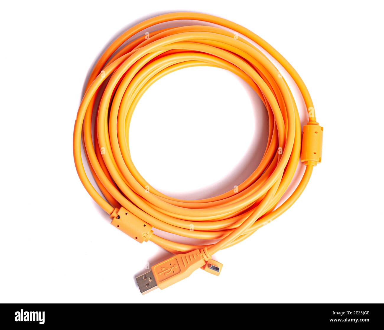 Orange rolled cable isolated on white background. Stock Photo