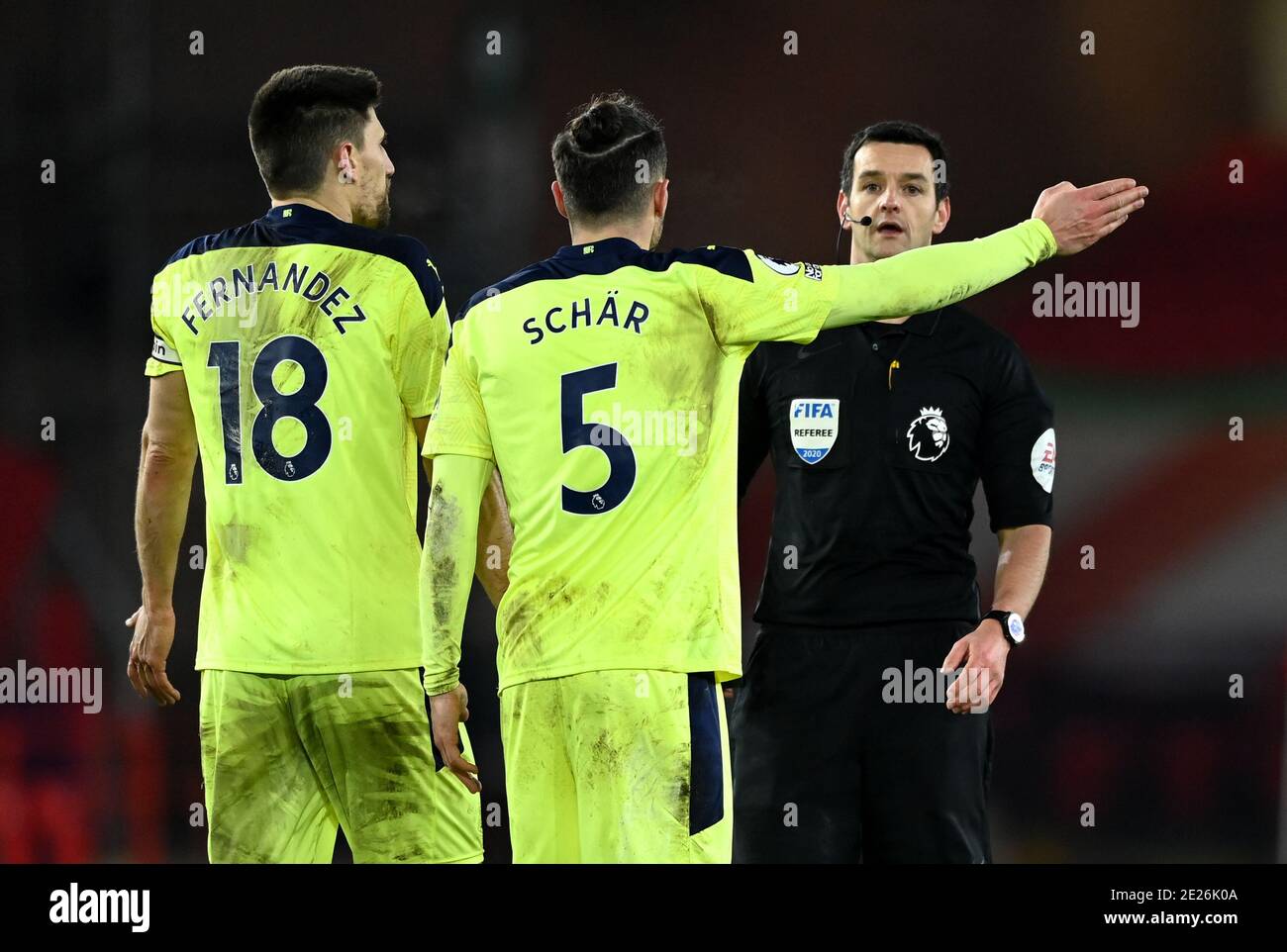 Newcastle United's Federico Fernandez (left) and Fabian Schar complain to the referee after Sheffield United's Billy Sharp (not pictured)scores a penalty during the Premier League match at Bramall Lane, Sheffield. Stock Photo