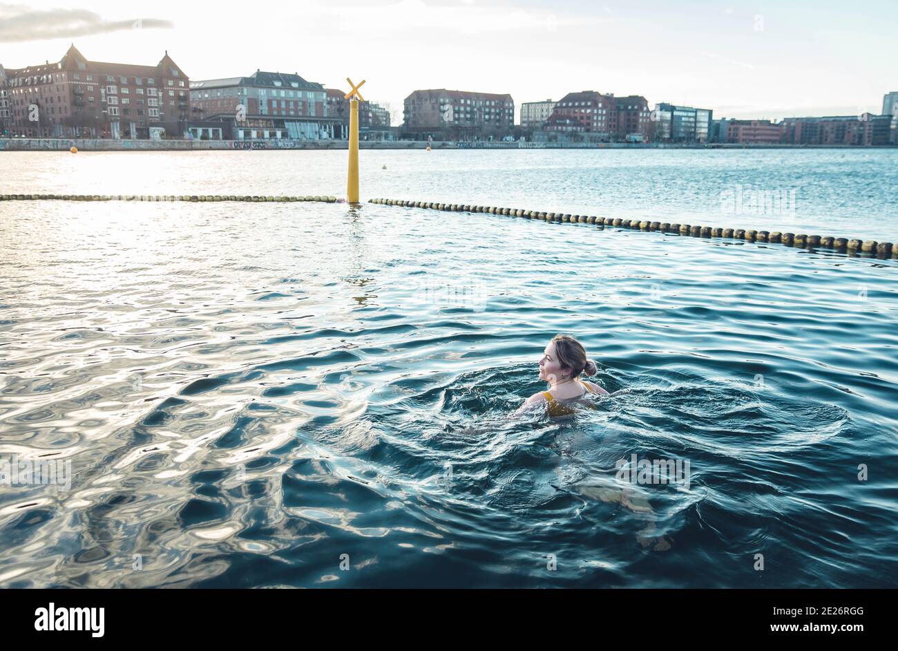 Millennial Peacefully Swimming in Cold Water In Copenhagen Denmark