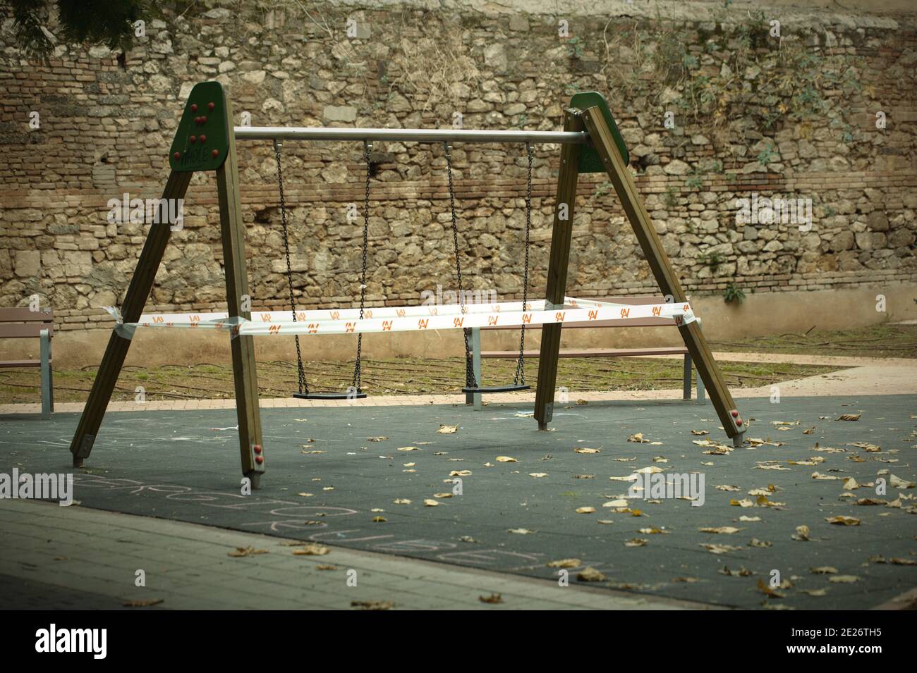 Cordoned off A-frame swing in a kids playground Stock Photo - Alamy